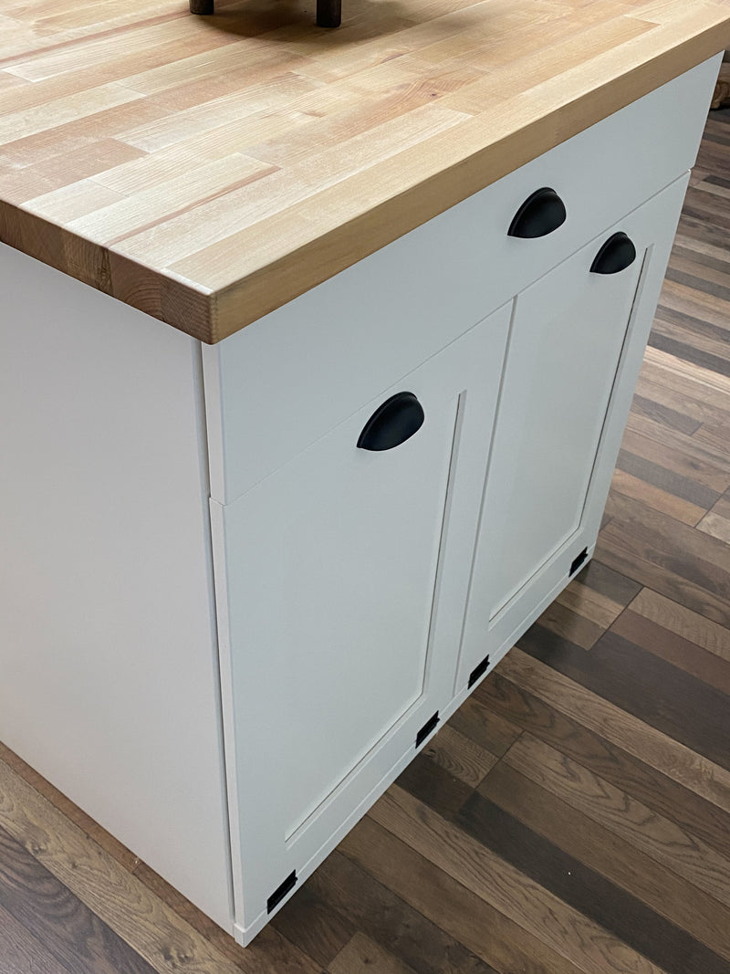 Island in white with a butcher block top
