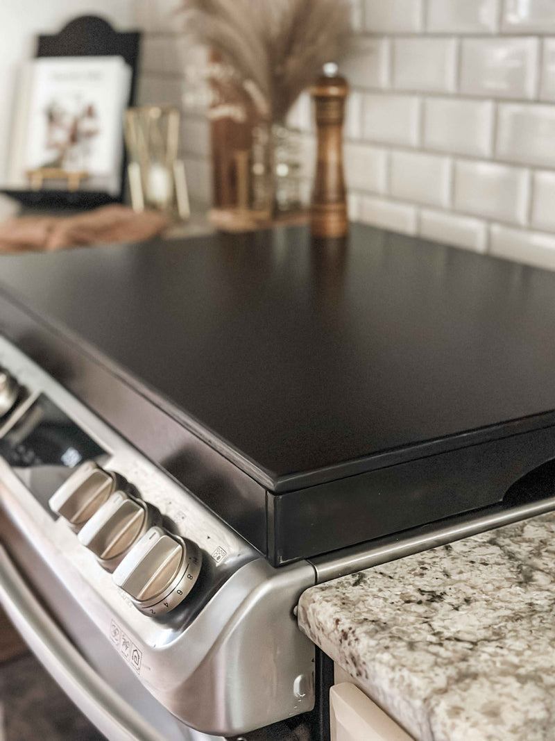 Clean and simple minimalist black stove cover