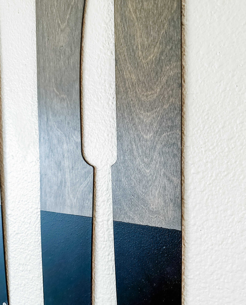 Fork, spoon, and knife wall decor in dark charcoal with aged barrel stain