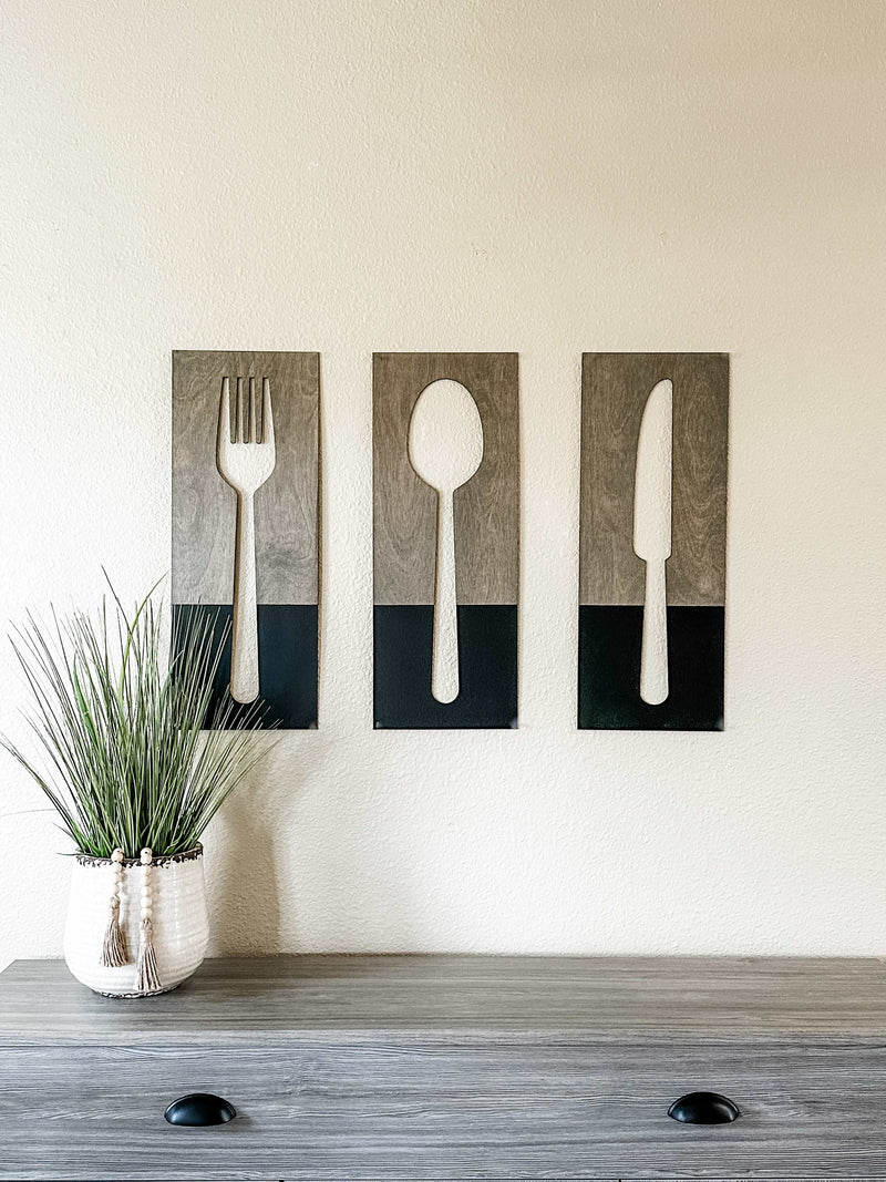 Fork, spoon, and knife wall decor in dark charcoal with aged barrel stain
