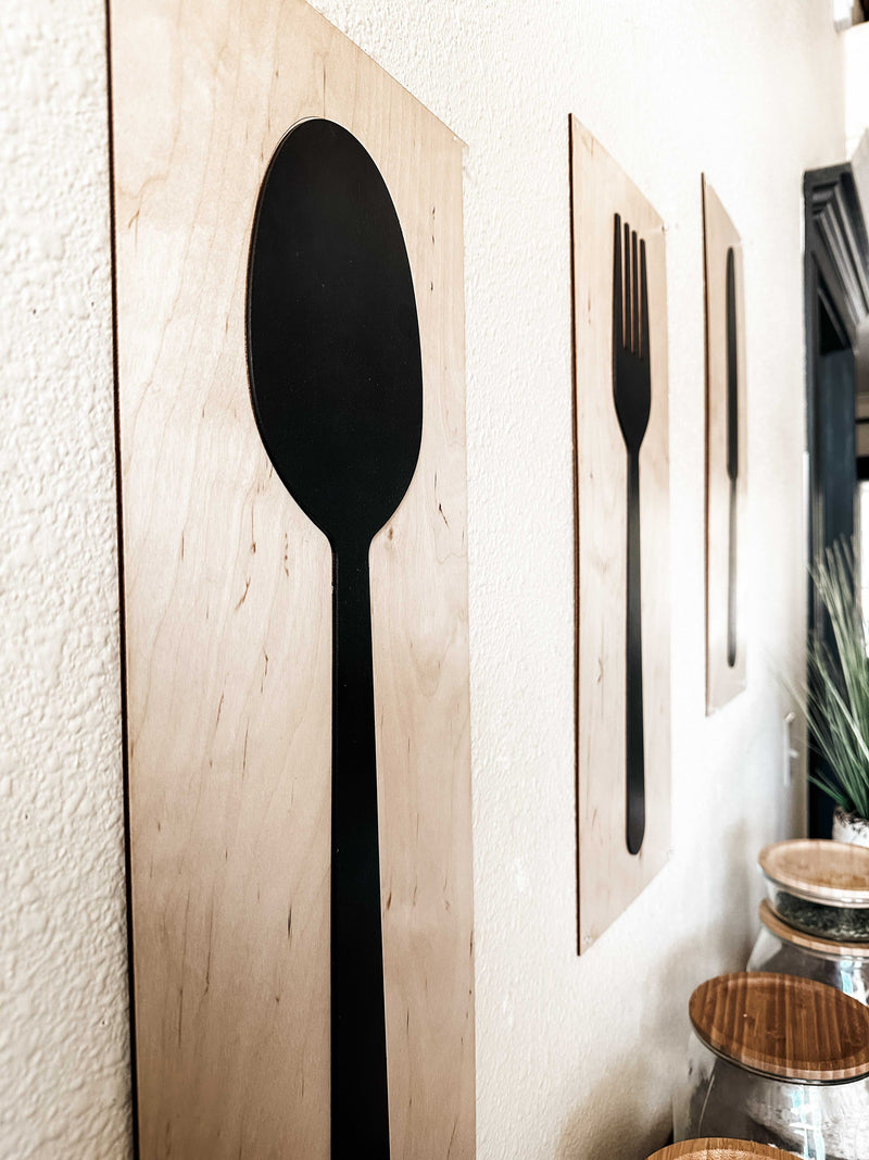 Fork, spoon, and knife set handmade of wood wall decor in dark charcoal with natural wood layered
