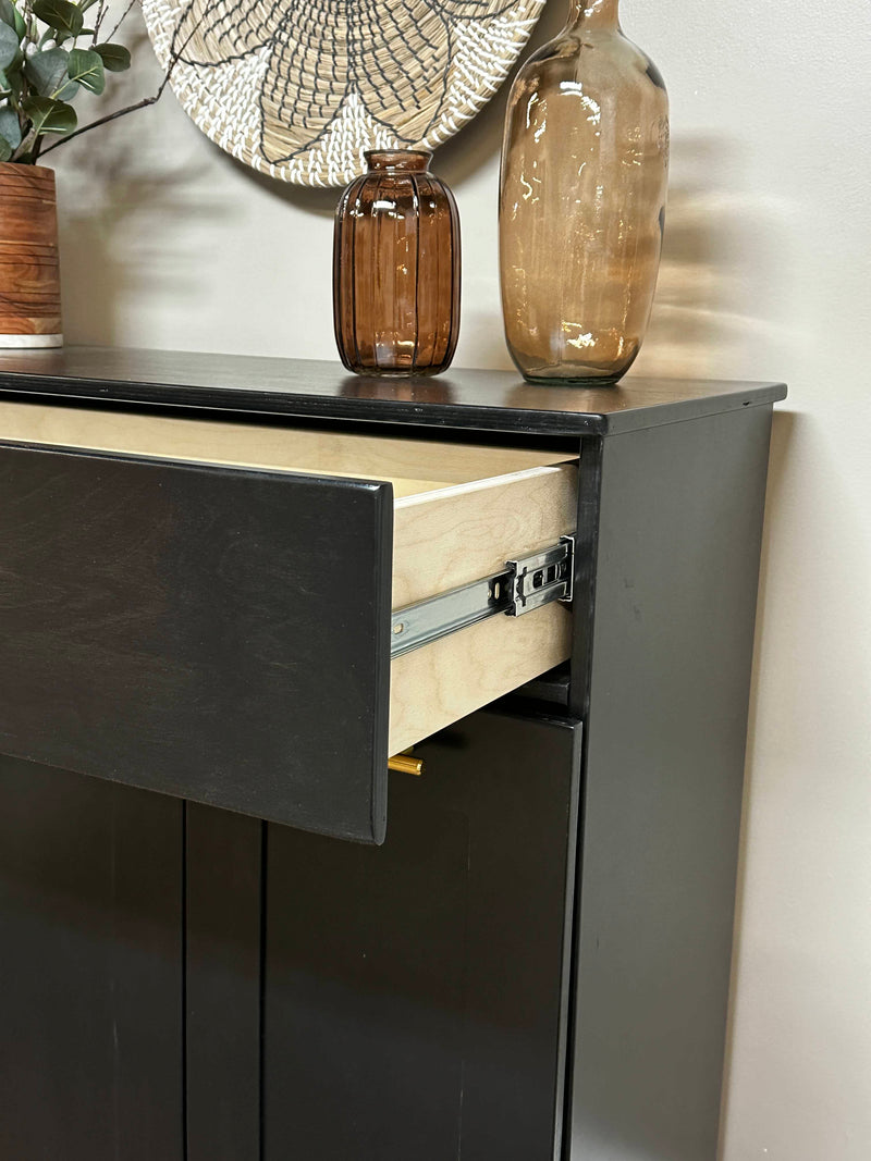 Prescott with a storage drawer in black farmhouse style doors