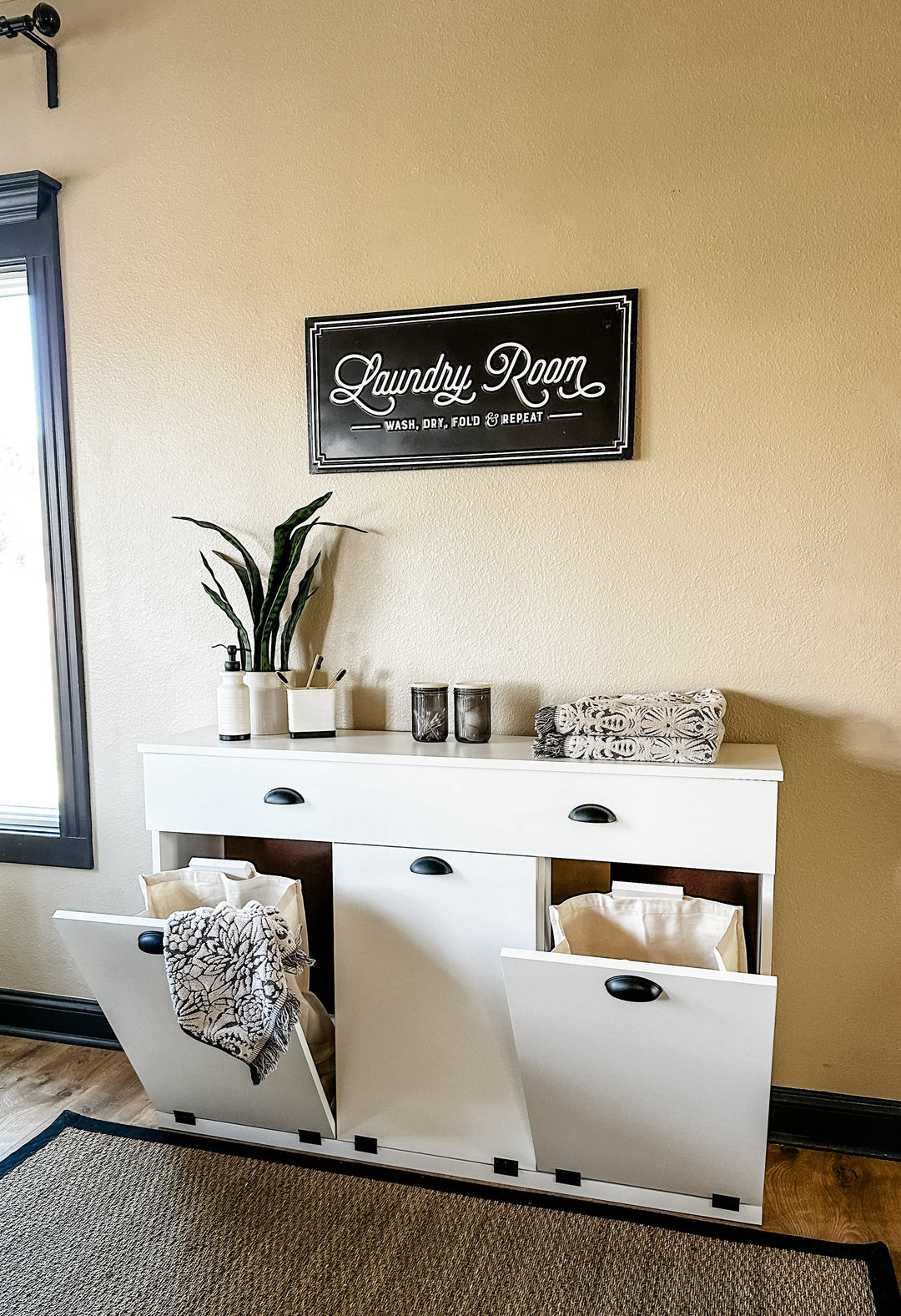 triple laundry hamper with a drawer