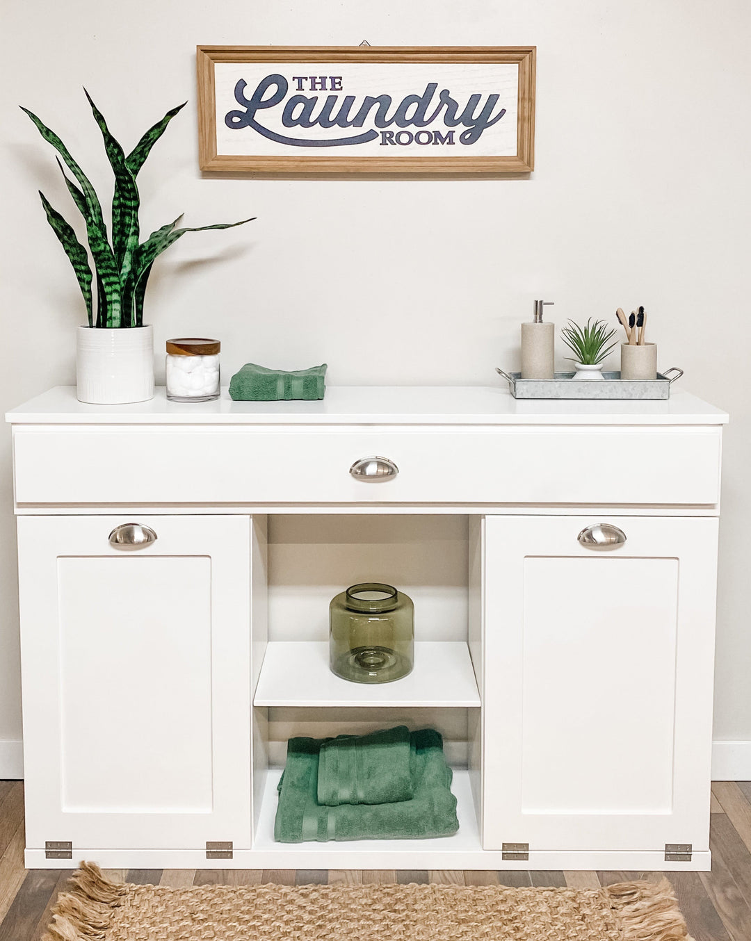 Triple laundry with a storage drawer and open shelving in white
