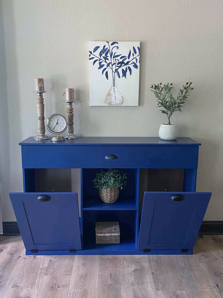Triple trash cabinet with a storage drawer and open shelving in blue