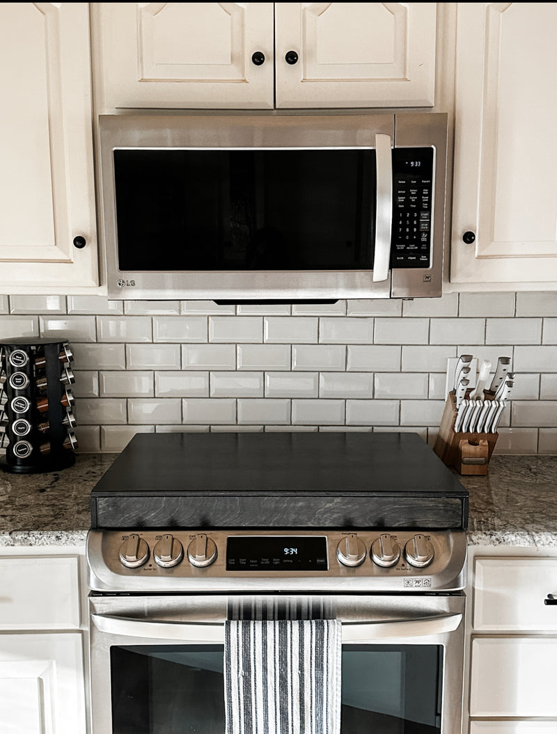 Clean and simple minimalist black stove cover