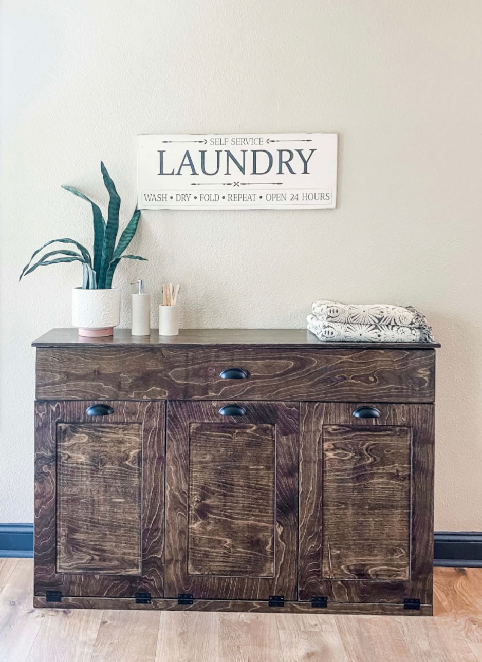 Furniture style laundry with a storage drawer in dark brown stain