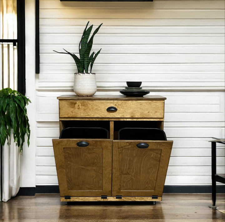 Double style trash cabinet with a storage drawer in golden oak stain
