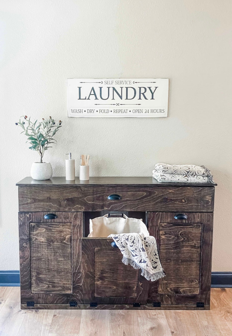 Furniture style laundry with a storage drawer in dark brown stain