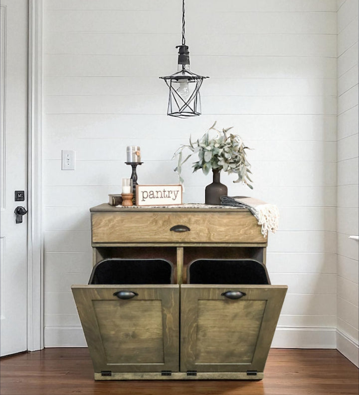 Counter tall hidden trash cabinet with a storage drawer in aged barrel stain