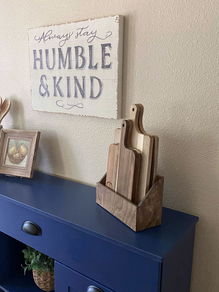 Triple trash cabinet with a storage drawer and open shelving in blue