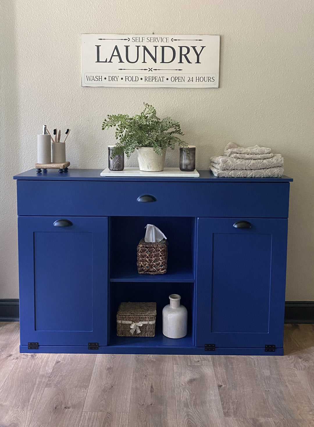 3 bin laundry with a storage drawer and open shelving in blue