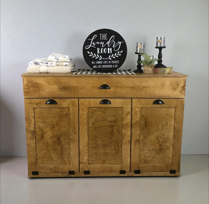 Triple laundry with a storage drawer in golden oak stain
