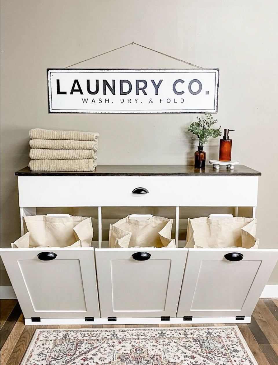 Triple counter tall laundry with a storage drawer in white