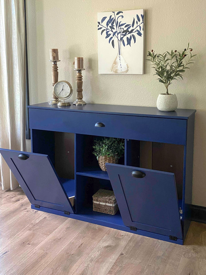 Triple trash cabinet with a storage drawer and open shelving in blue