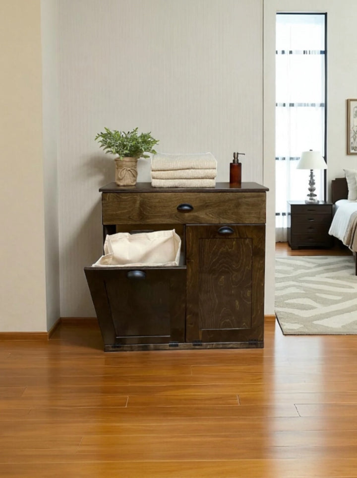 Counter tall laundry cabinet with a storage drawer in dark brown stain