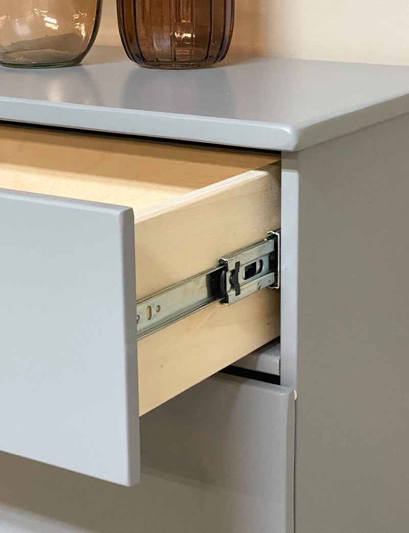 Sinclair with a storage drawer in gray modern door.