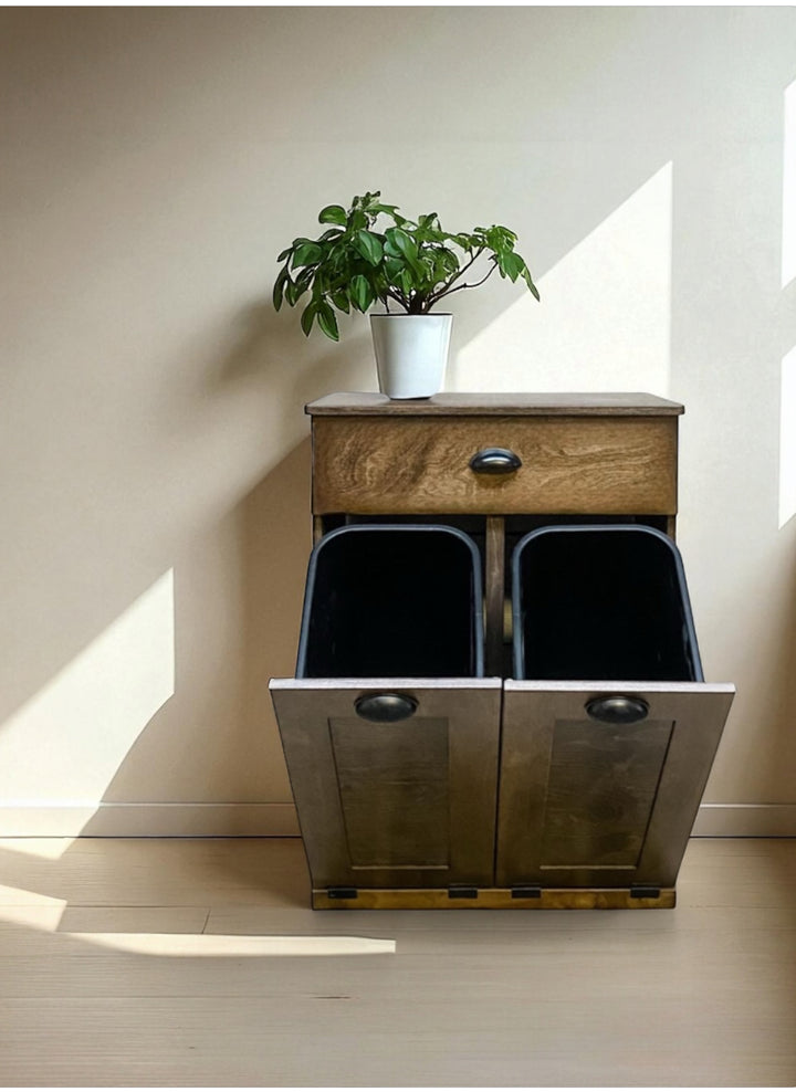 Counter high, slim trash cabinet design. Includes a storage drawer in dark brown