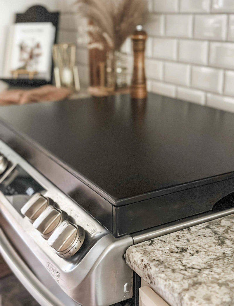 Clean and simple minimalist black stove cover