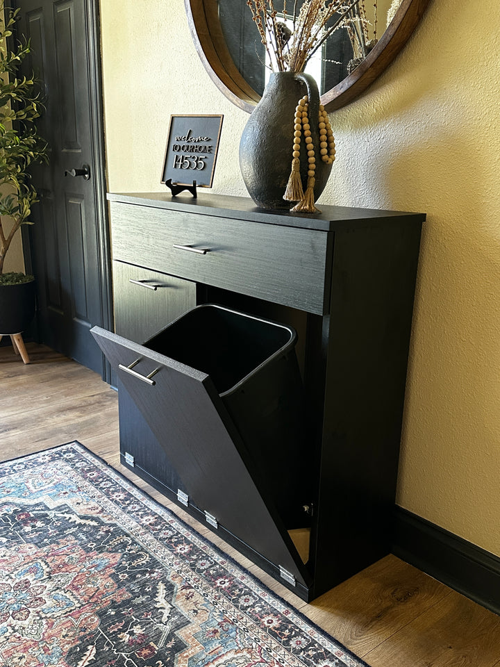 Free standing hidden trash cabinet with a storage drawer in black stain