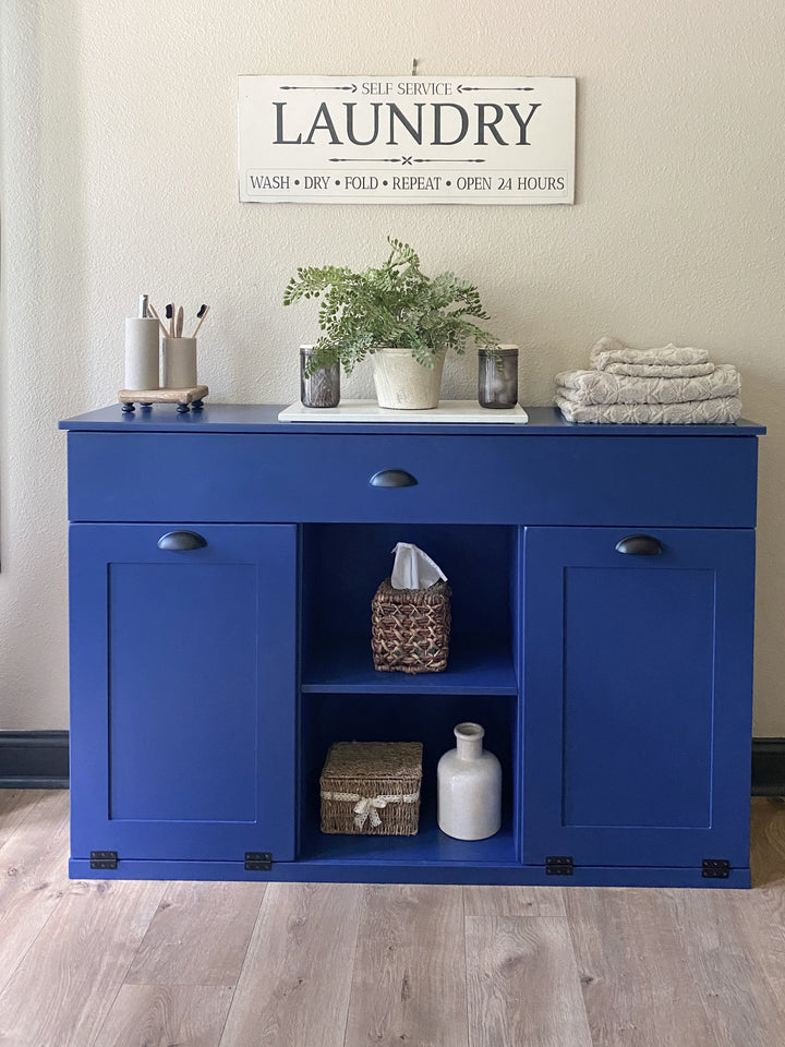 3 bin laundry with a storage drawer and open shelving in blue