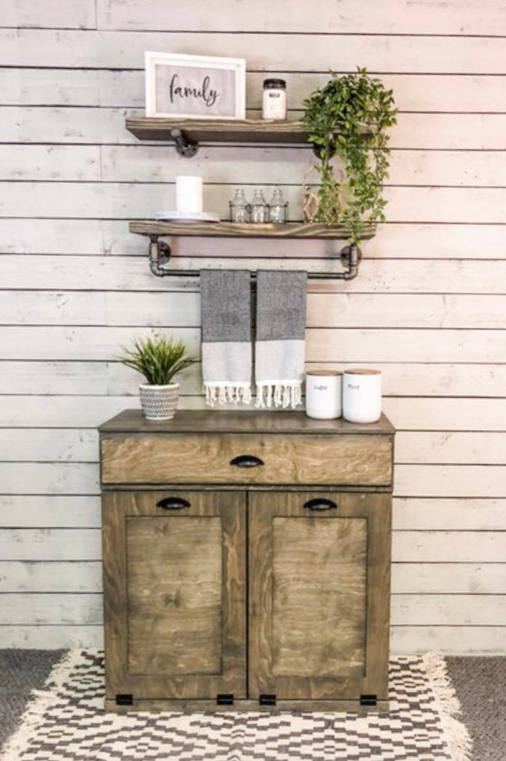 Counter tall hidden trash cabinet with a storage drawer in aged barrel stain
