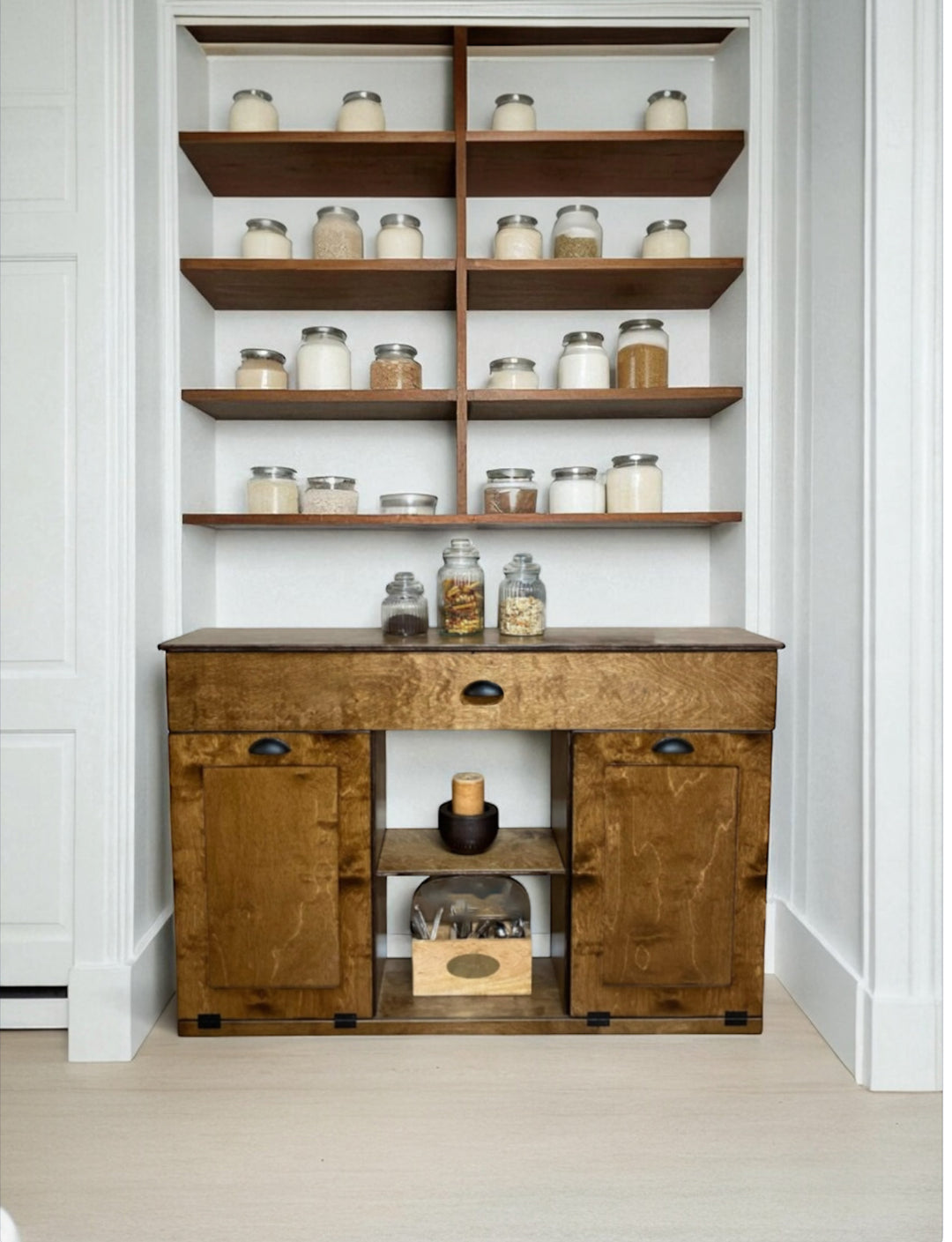 Triple tilt-out with a storage drawer and open shelving in warm brown stain