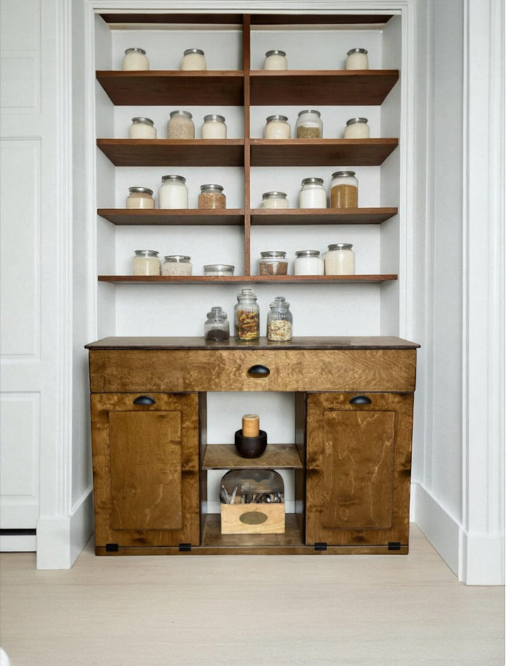 Triple tilt-out with a storage drawer and open shelving in warm brown stain