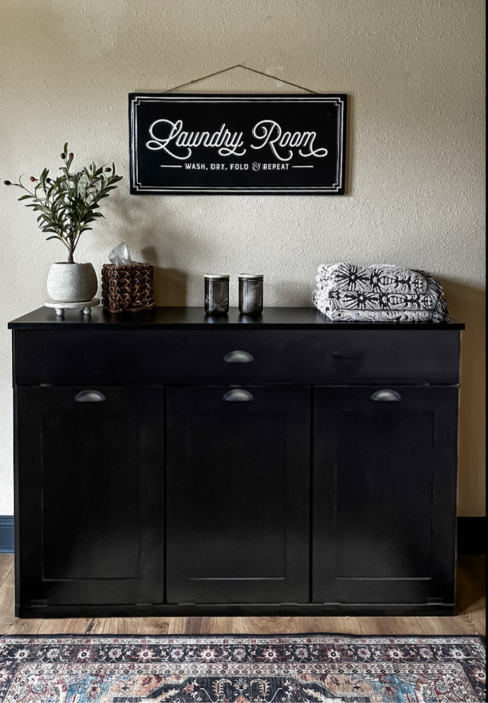 Furniture style laundry with a storage drawer in black stain