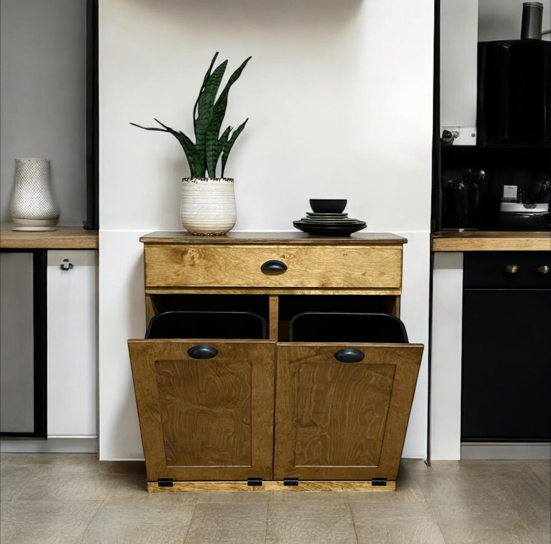 Double style trash cabinet with a storage drawer in golden oak stain