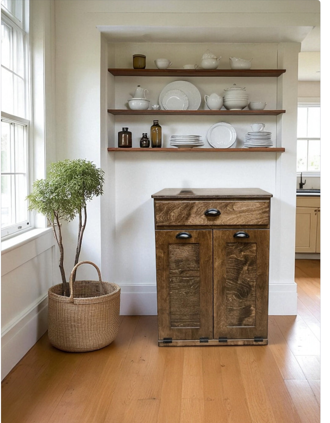 Counter high, slim trash cabinet design. Includes a storage drawer in dark brown