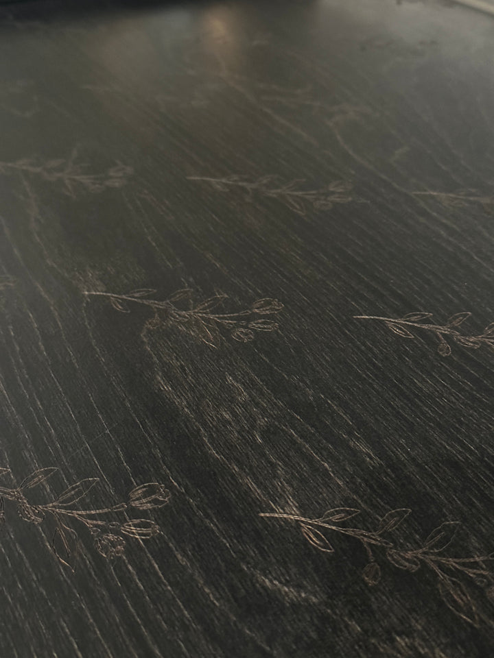Floral pattern stove cover in black stain
