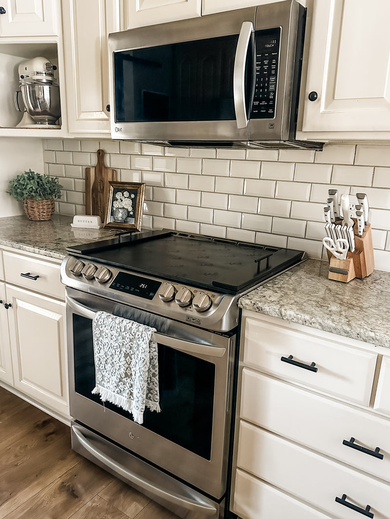 Floral pattern stove cover in black stain