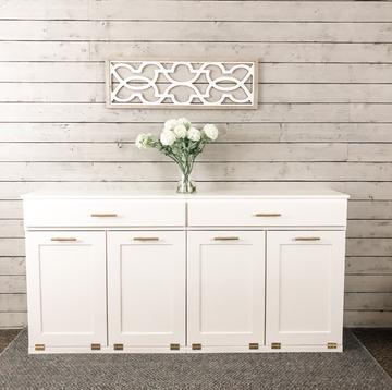 4 bin quad tilt out trash cabinet with a storage drawer in white
