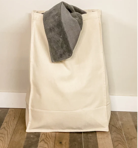 Double laundry with a storage drawer in golden oak counter high