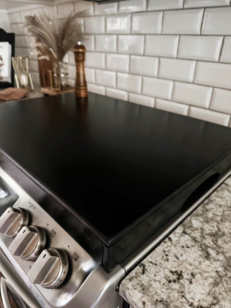 Clean and simple black stove cover. Minimalist design