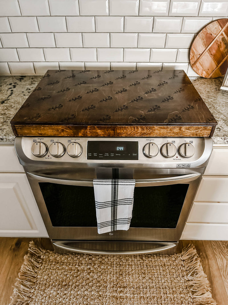 Floral pattern stove cover in warm brown