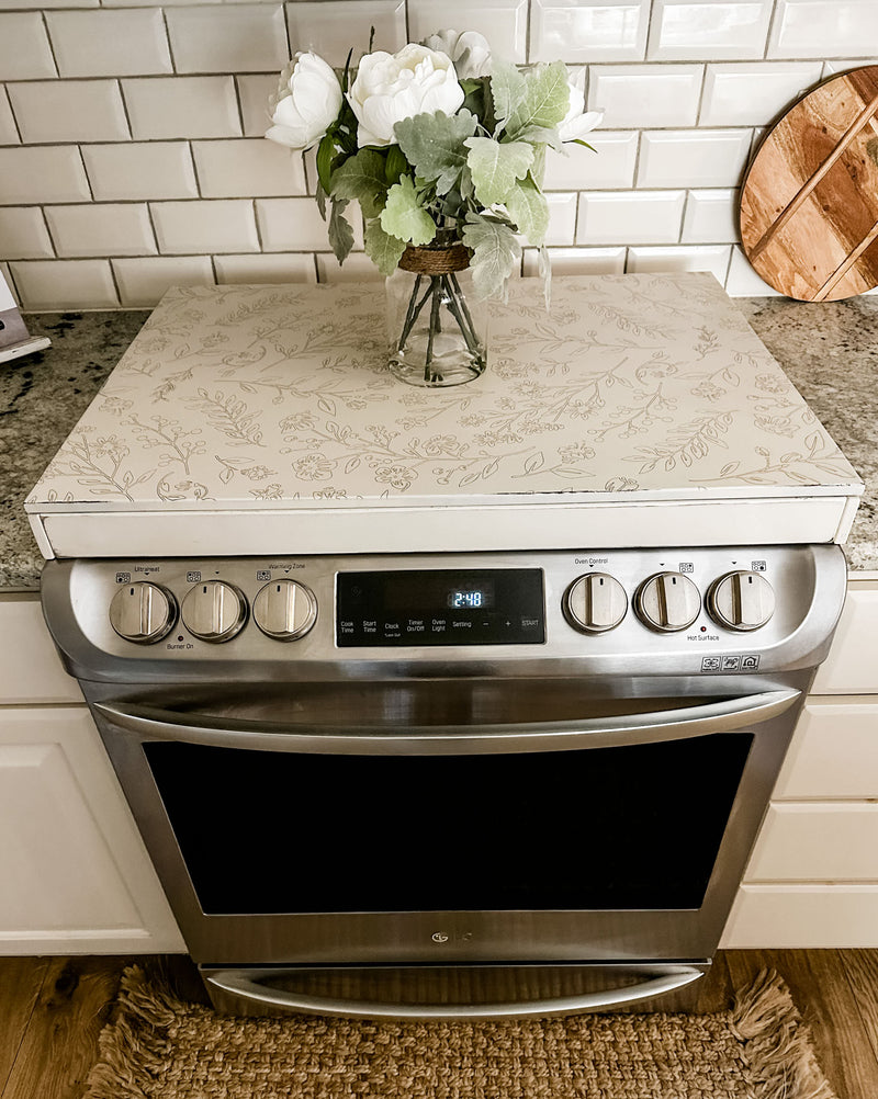 Engraved floral pattern stove cover, ivory distressed