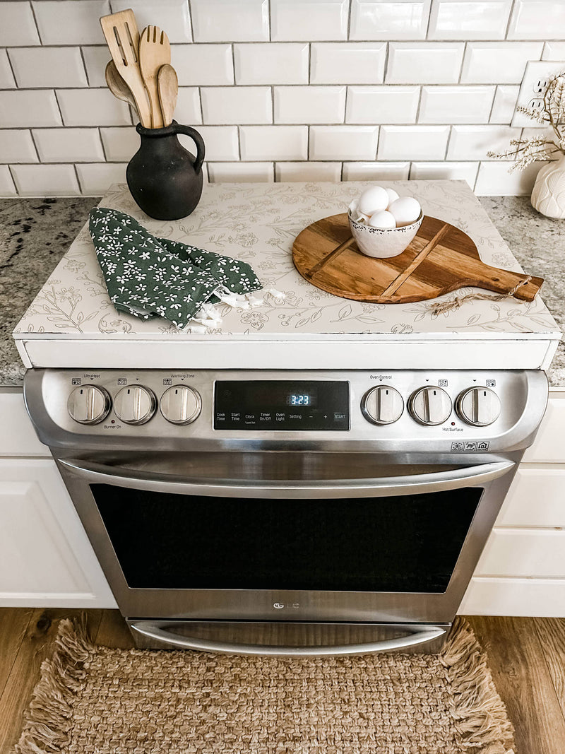 Engraved floral pattern stove cover, ivory distressed