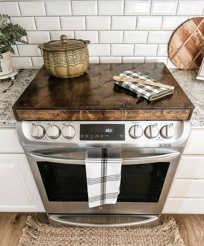 Floral pattern stove cover in warm brown