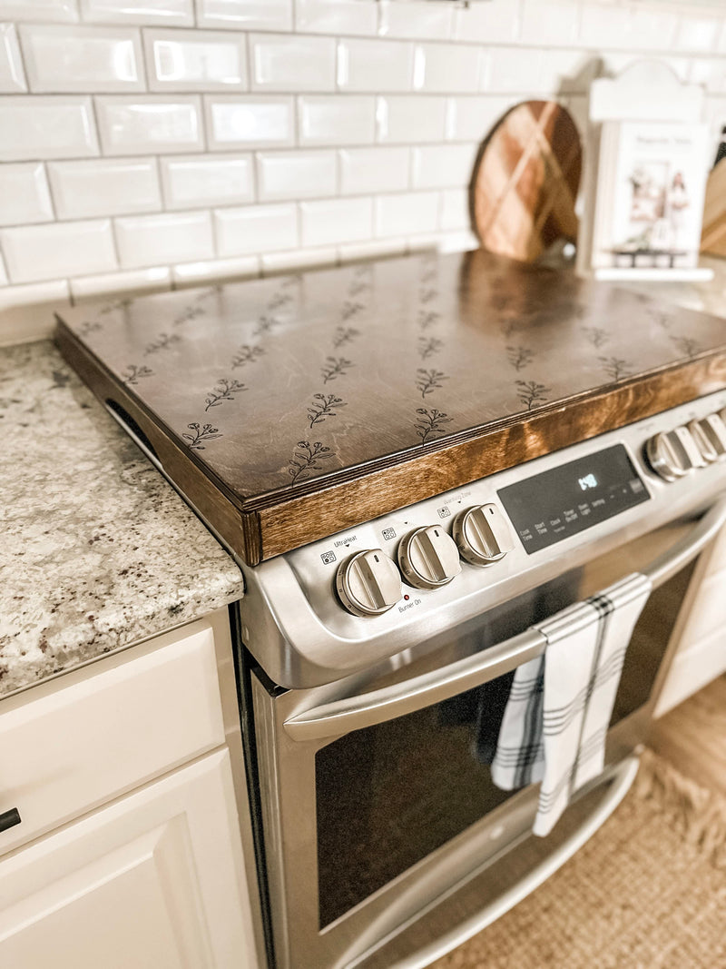 Floral pattern stove cover in warm brown