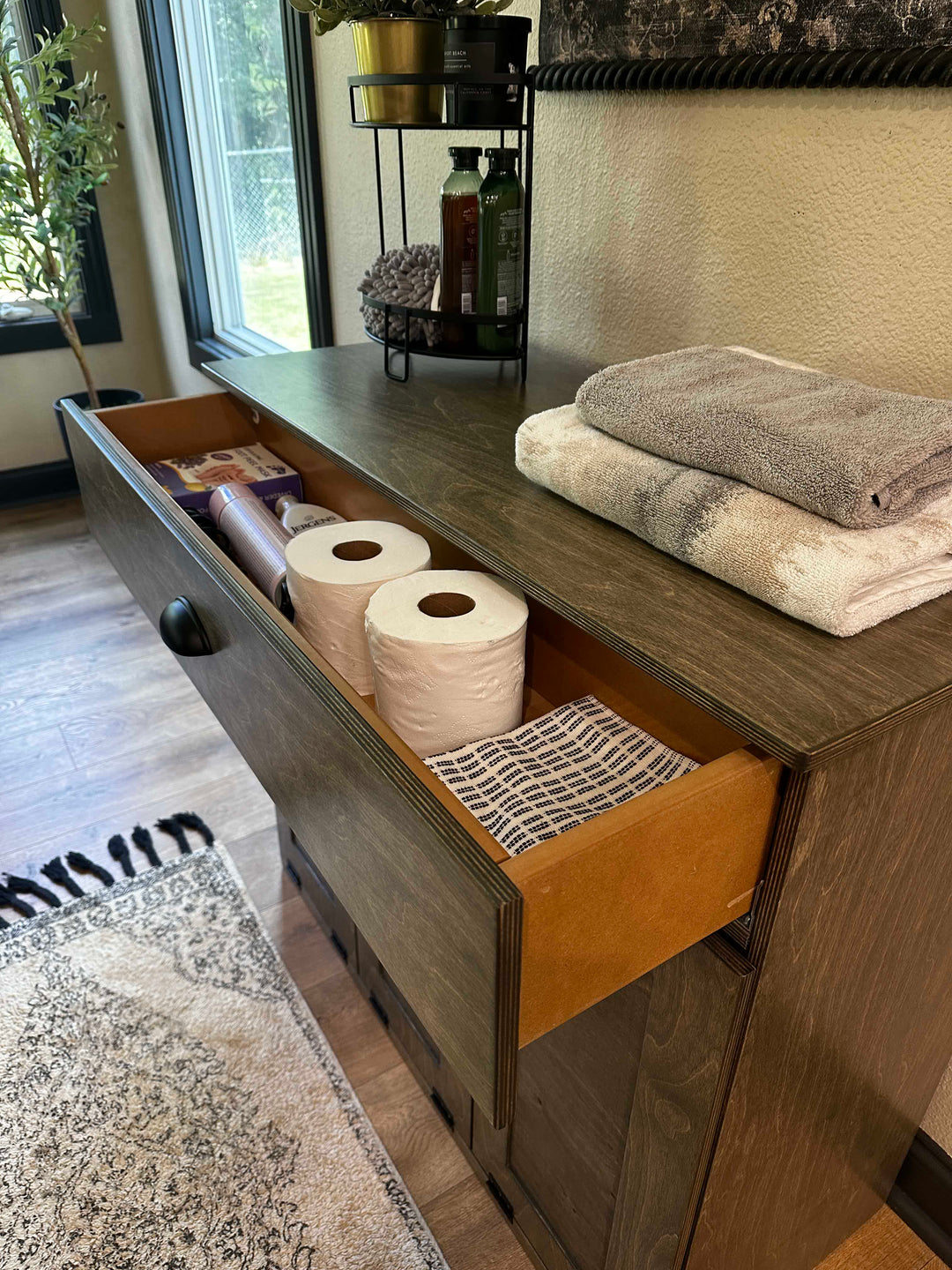 Slim laundry with a storage drawer in aged barrel stain