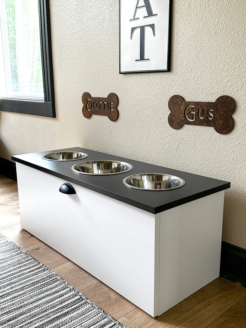 3 bowl elevated dog feeder with storage drawer with drawer in black and white