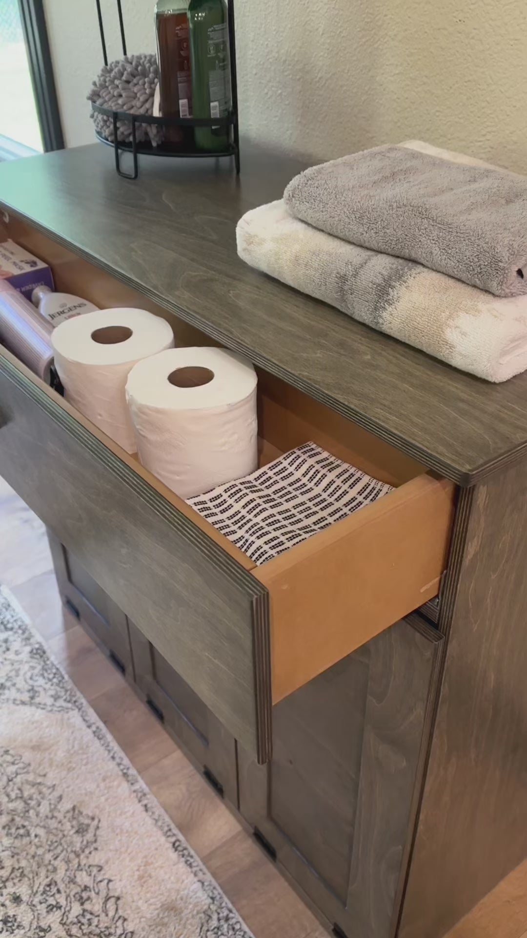 Slim laundry with a storage drawer in aged barrel stain