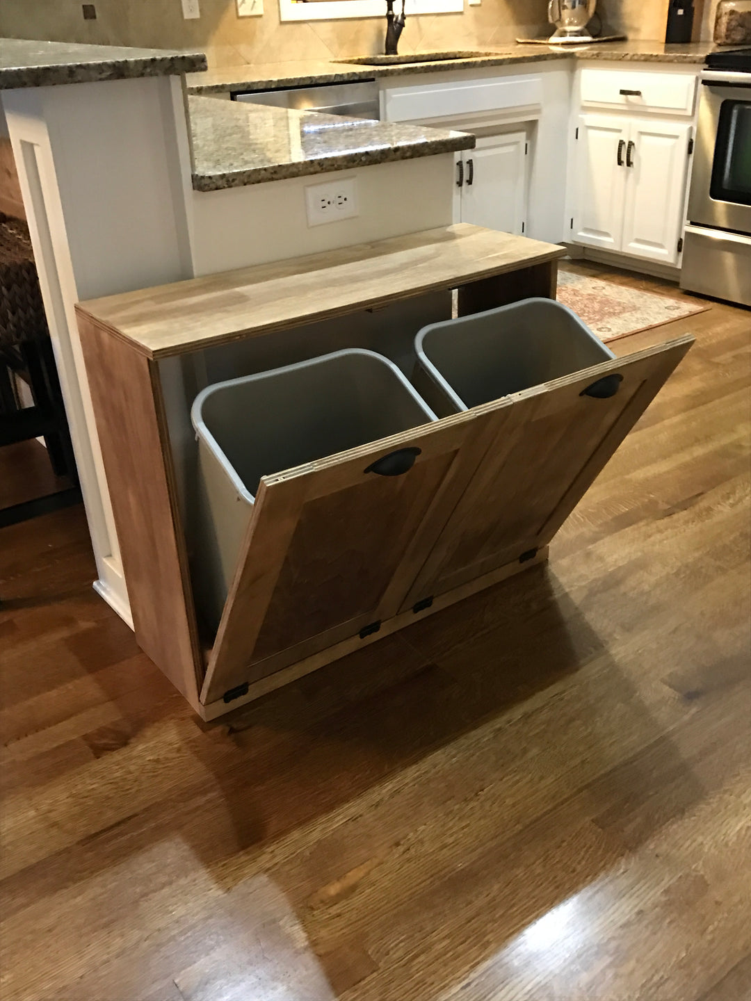 Furniture style double trash cabinet in golden oak