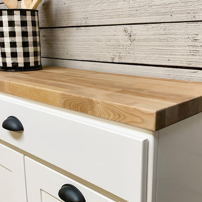 butcher block top for tilt out trash bins and laundry hampers. This is an add on item to your purchase.