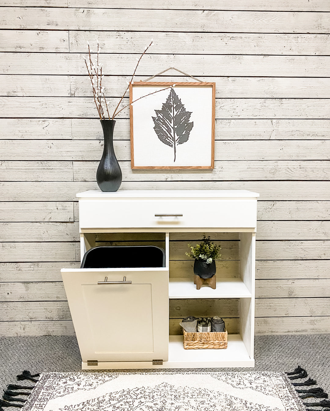 Double size- trash compartment with a storage drawer and open shelving in white