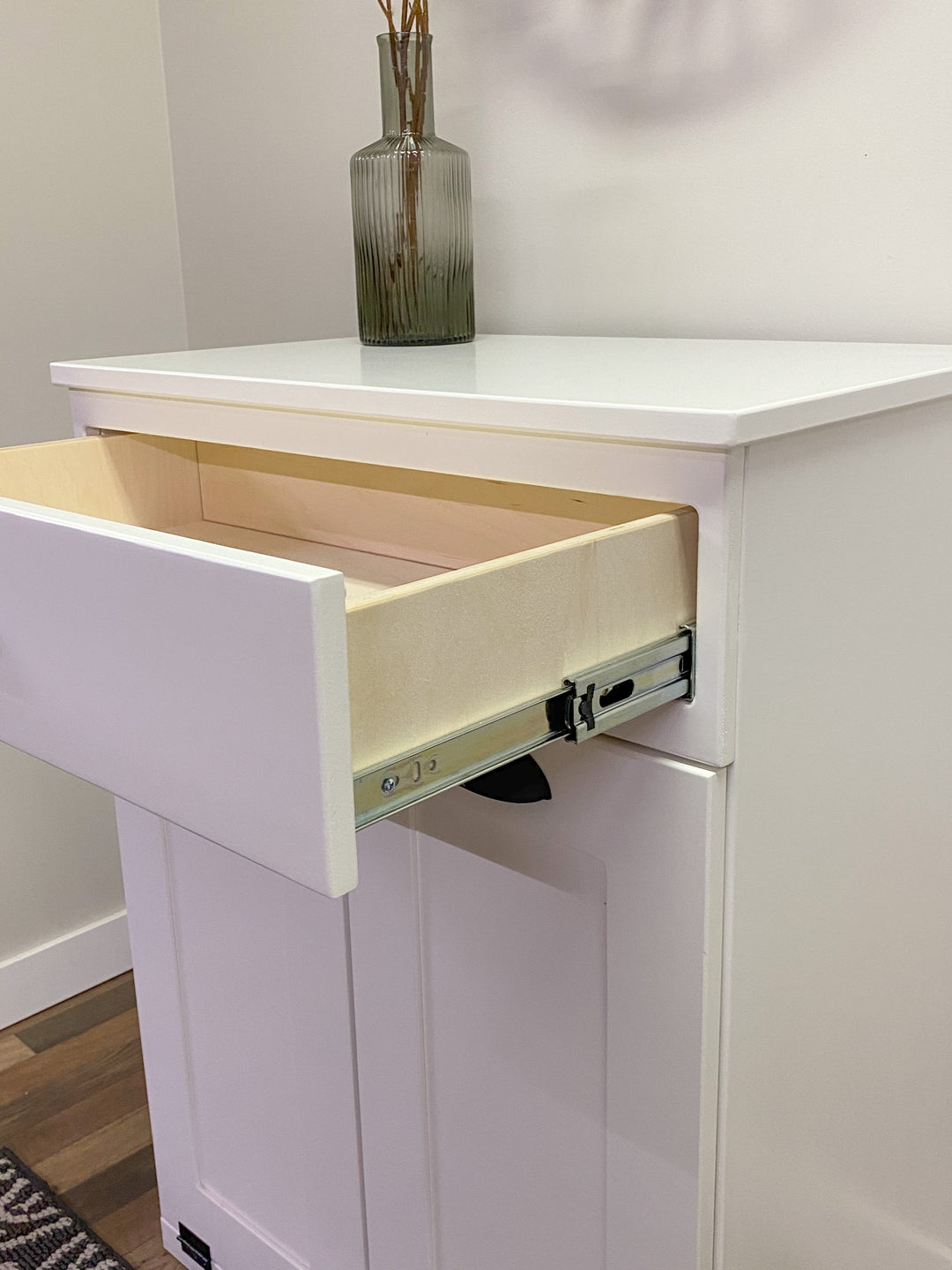 Narrow double cabinet to hide trash with a storage drawer in white