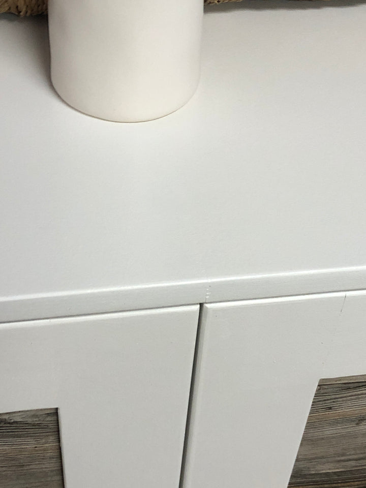 Four bin laundry sorter with a storage drawer in white