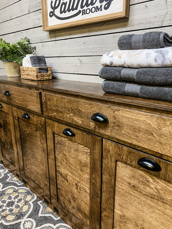Quad laundry with a storage drawer in warm brown stain